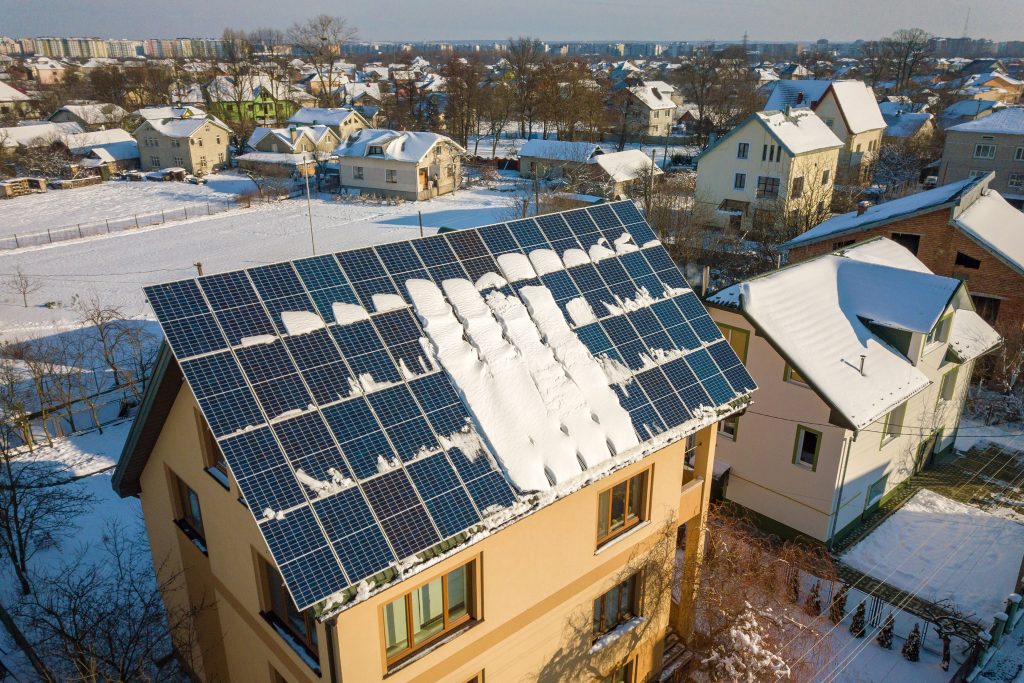 solar panels in winter that have snow on them